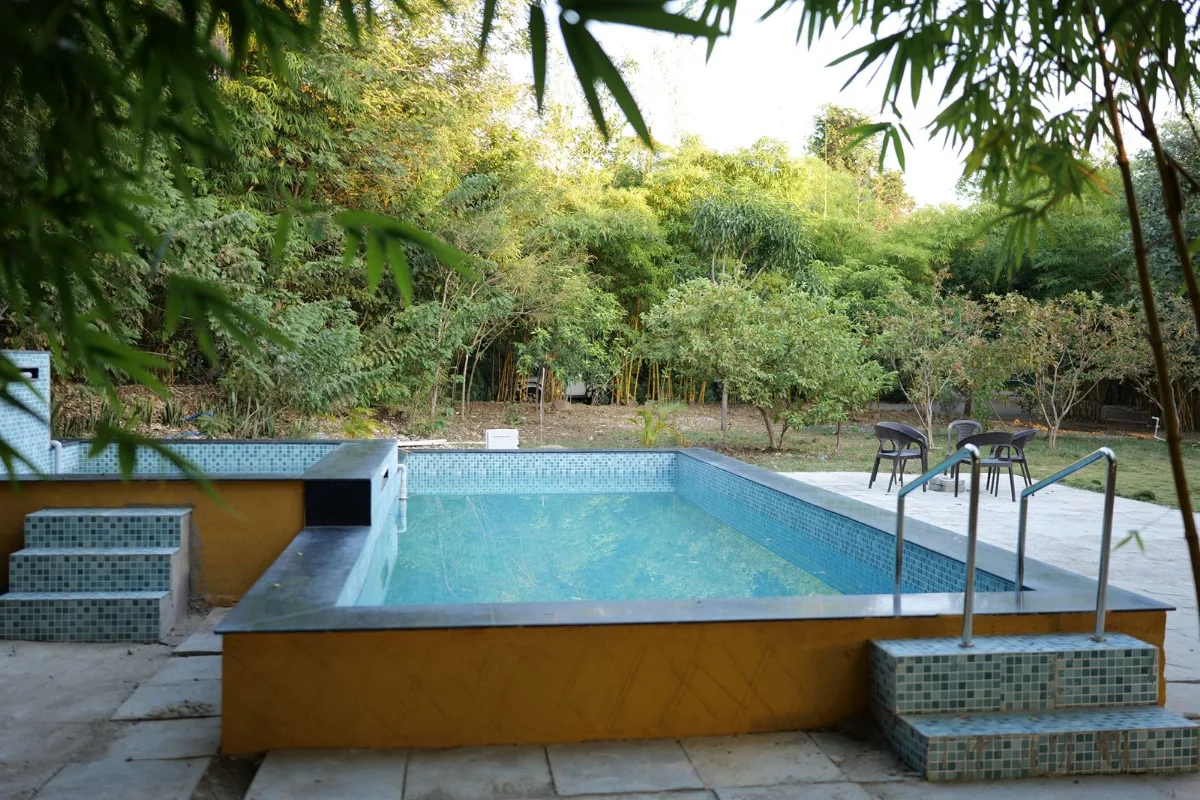 Swimming pool at a Nature's Sprouts jungle resort near Tadoba