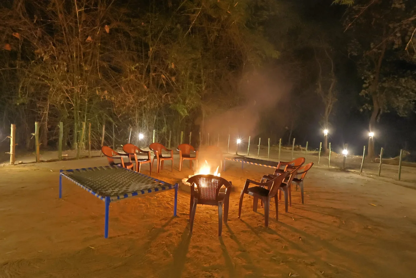 Bonfire and seating area at Wildmark Resort near Kanha