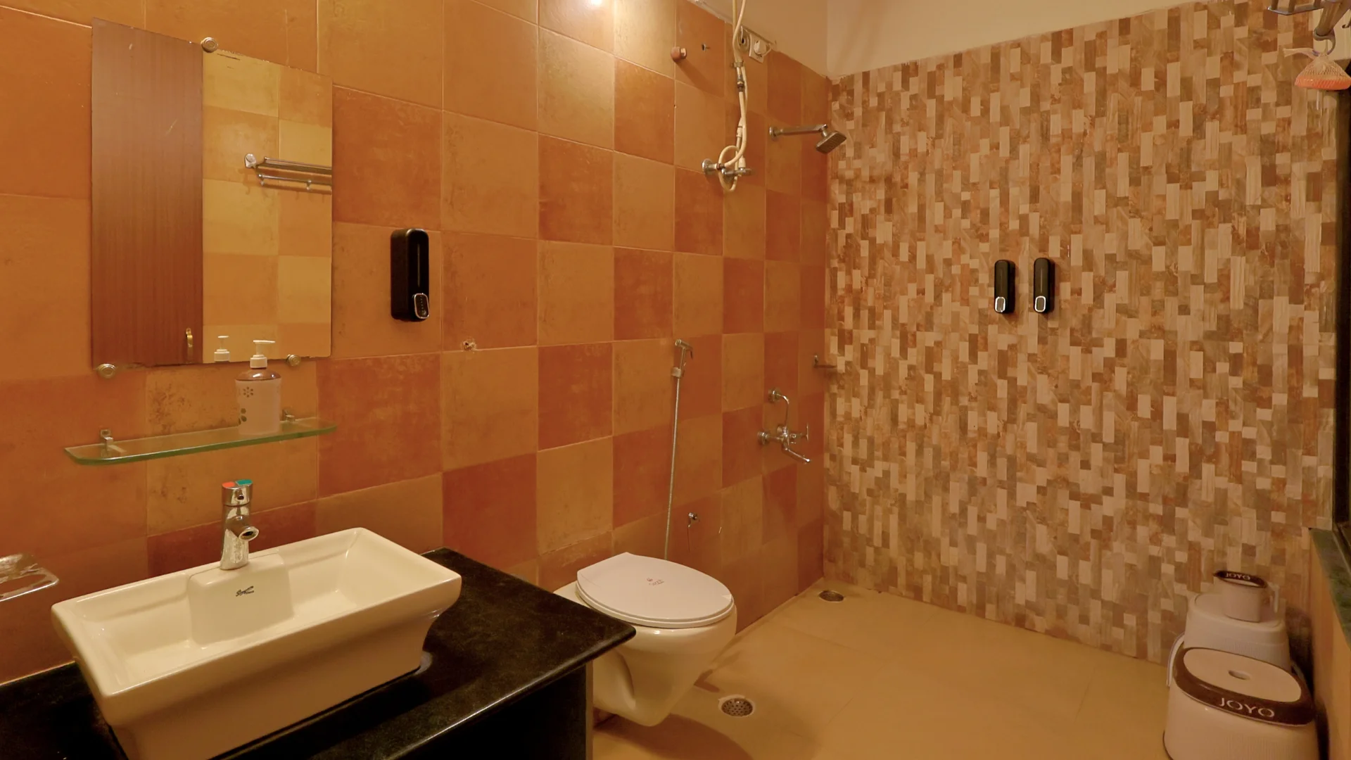 Modern washroom of Super Deluxe Room at Wildmark Kanha Resort.