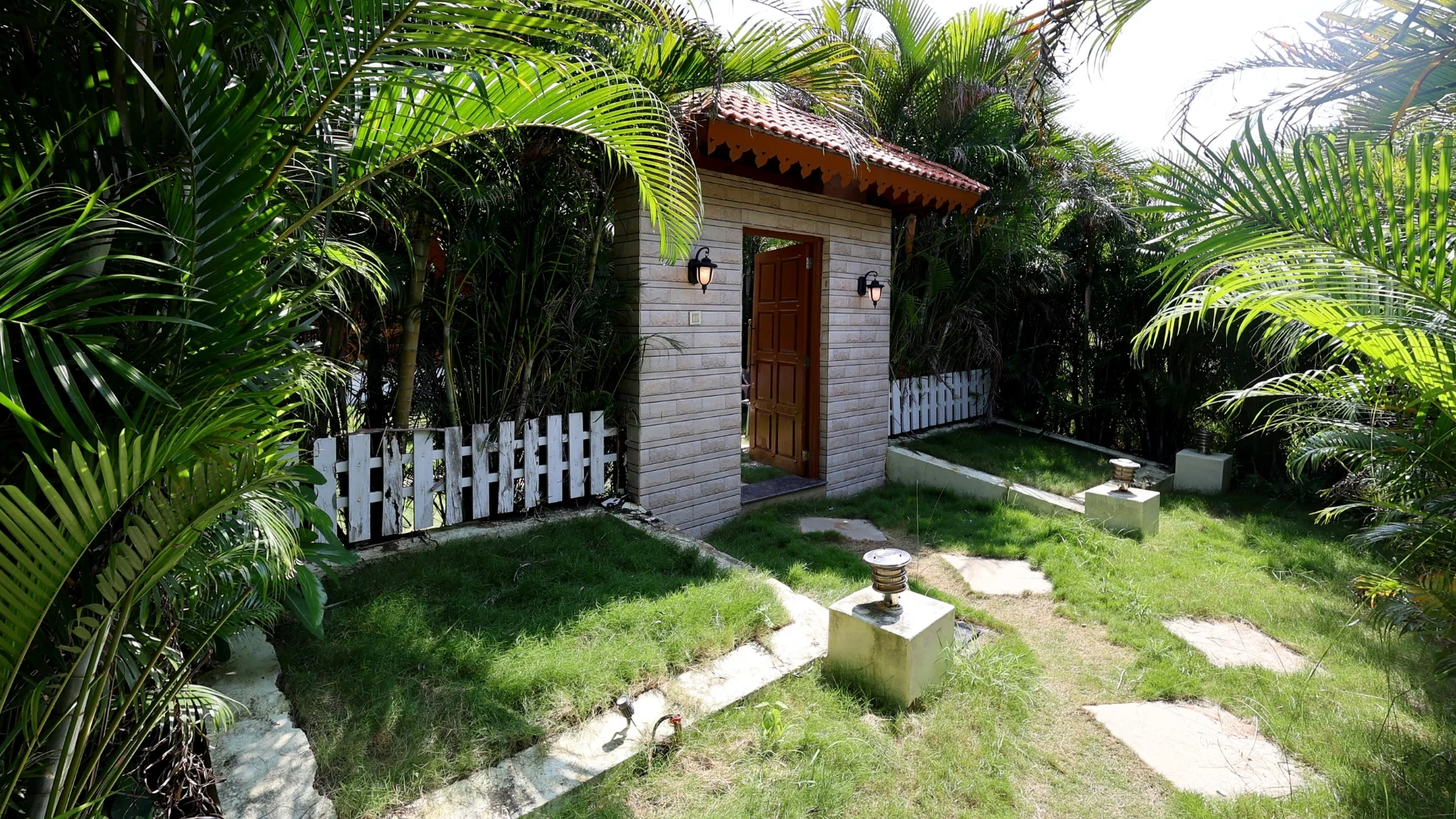 Outdoor garden space of Pine Cottage at Zeal Resort Tadoba