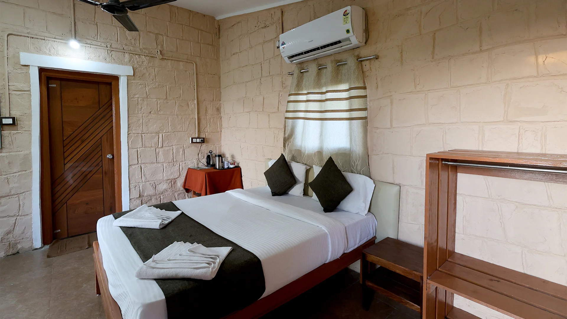 Luxury Machaan Cottage featuring a comfortable bed at Tadoba