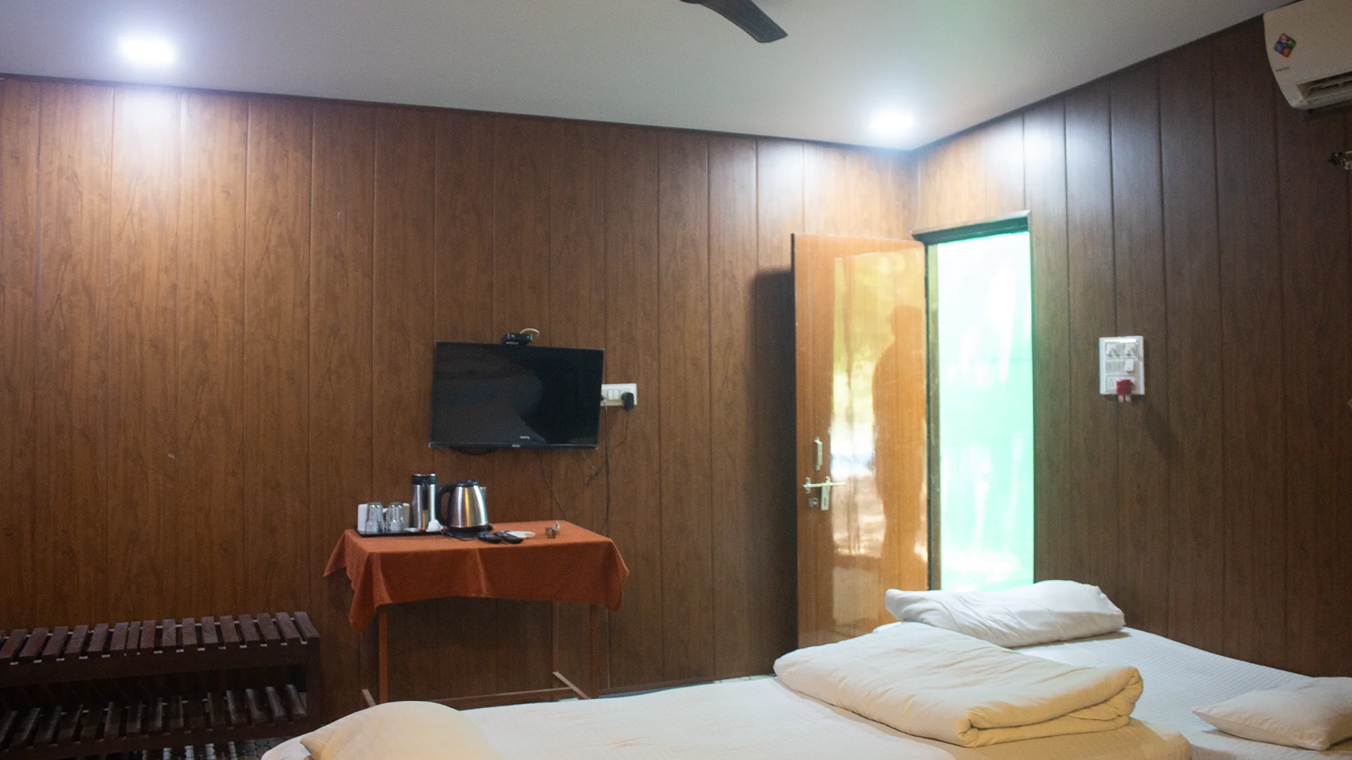 Air-conditioned Standard Room featuring a TV at Tadoba Safari Stay Resort